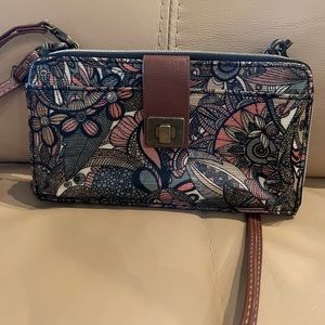 NWOT Sakroots crossbody bag with optional shoulder strap or wrist strap.